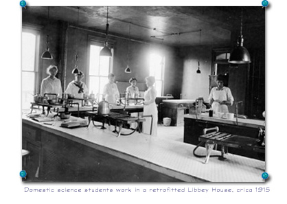 Domestic science students work in a retrofitted Libbey House, circa 1915